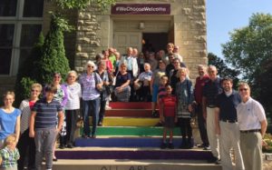 our congregation standing on our rainbow steps